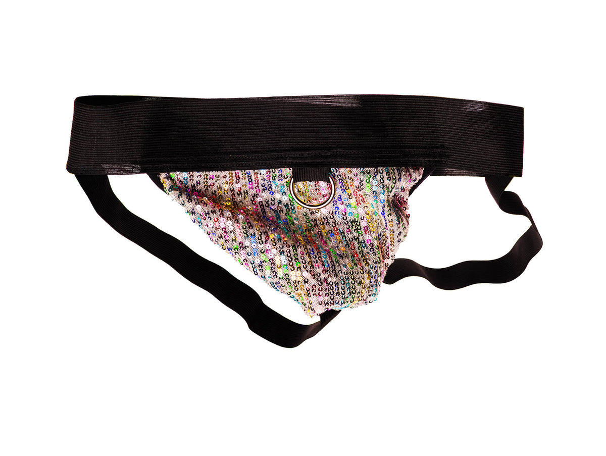A novelty flogger or whip with a wide black elastic waistband, a central gold metal ring, and a colorful, glittery patterned fabric body, shown against a plain white background.